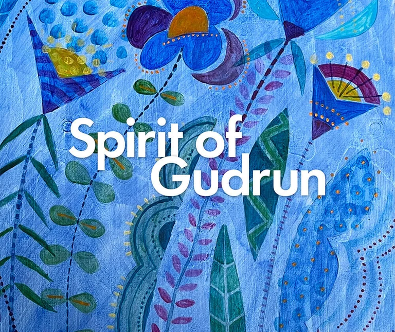 A blue watercolour painting by Gudrun Sjödén with the words “Spirit of Gudrun”
