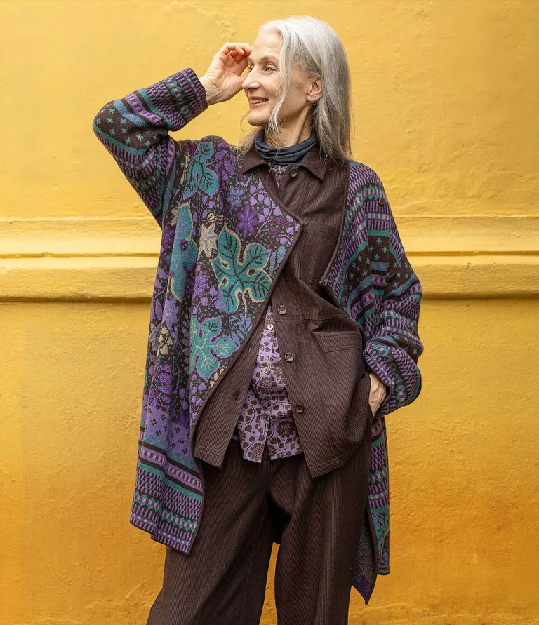 A woman wearing a purple blouse from Gudrun Sjödén. 