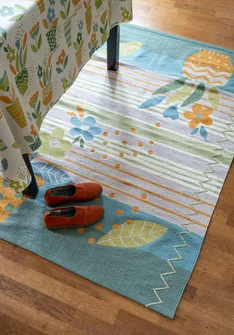 “Flower Bed” embroidered rug in organic cotton - celadon