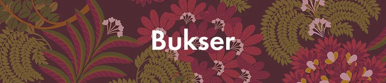 Et rødt og gult mønster med teksten «Bukser» i hvitt. 