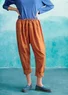Pantalon "Indra" en coton biologique tissé (rouge garance S)