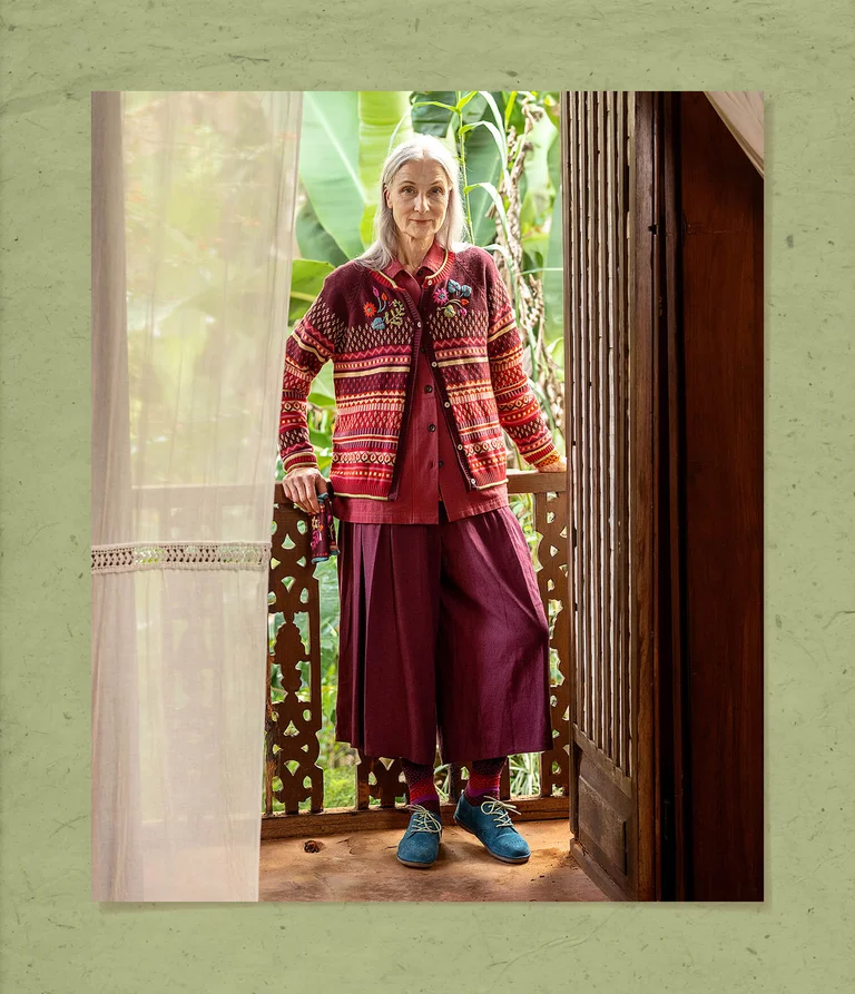 A woman wearing clothes in shades of red from Gudrun Sjödén.