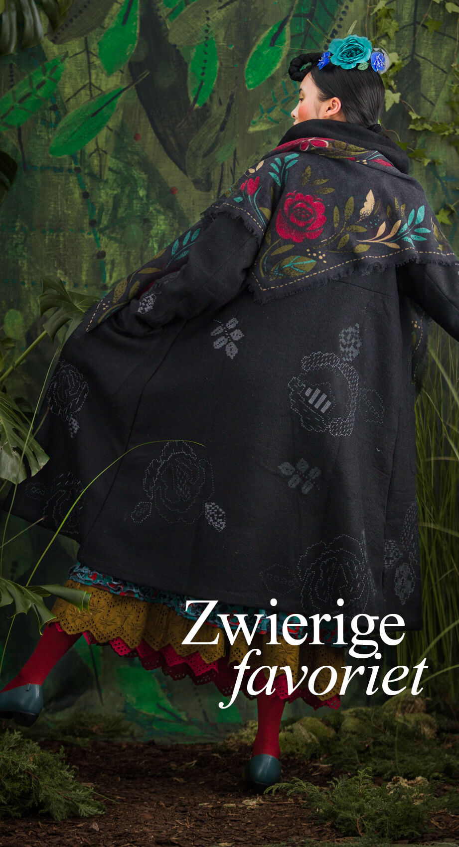 Large embroidered roses with a graphic look adorn this finely crafted coat. 