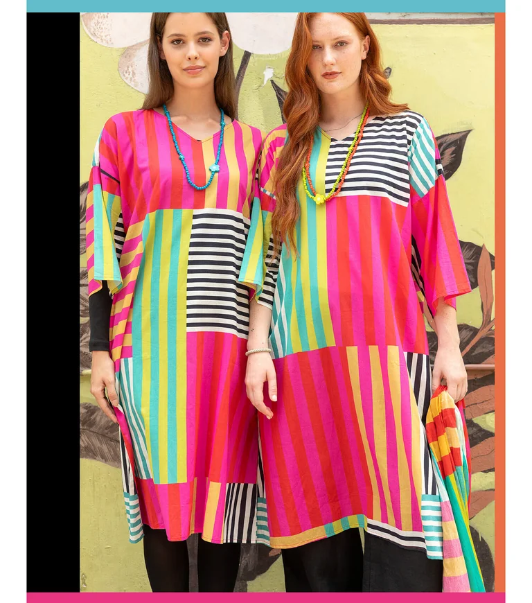 Two women wearing colorful striped dresses from Gudrun Sjödén.