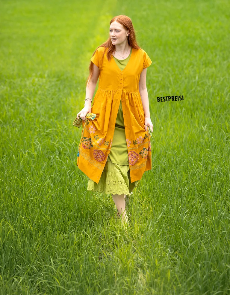 A woman wearing layers of clothing from Gudrun Sjödén.