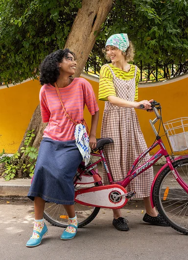 Two women wearing clothing from Gudrun Sjödén.