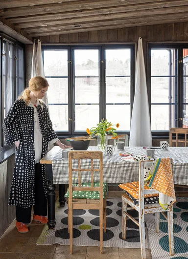 A table laid with home textiles from Gudrun Sjödén.