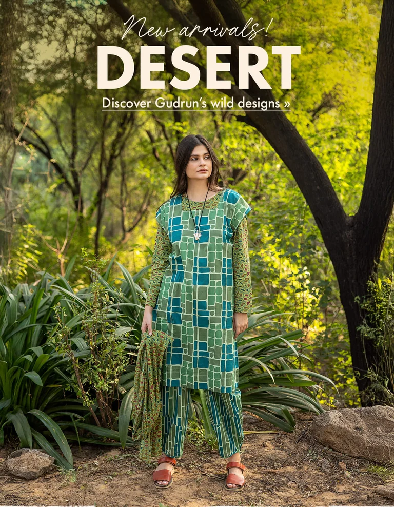 Three women standing next to each other outdoors wearing patterned clothes from Gudrun Sjödén.