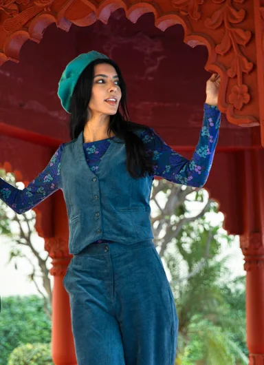 A woman wearing layers of woven clothes from Gudrun Sjödén.